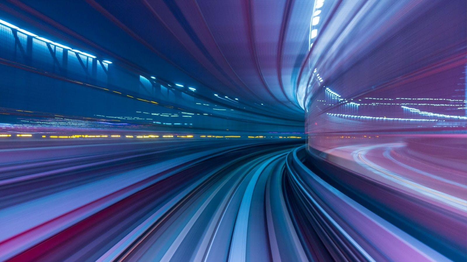 an image depicting speeding down a road heading toward a curve