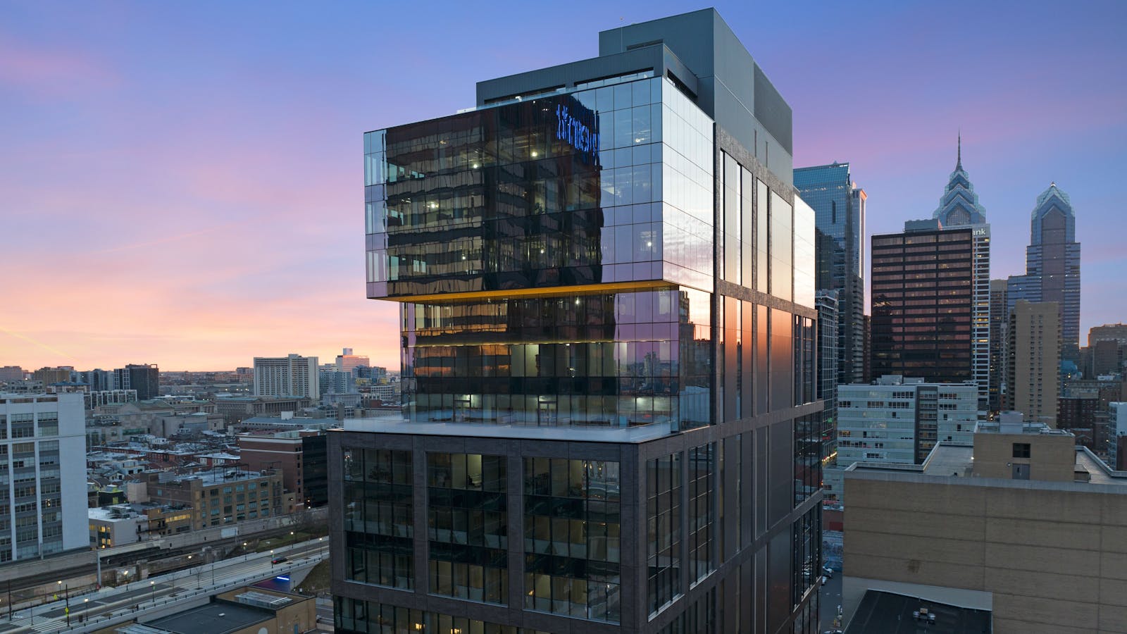 a glass-front 19-story office building in downtown Philadelphia, the City of Brotherly Love