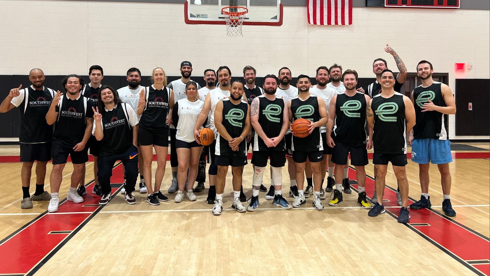 players at Southwest Industrial Electric's charity basketball tournament on the court