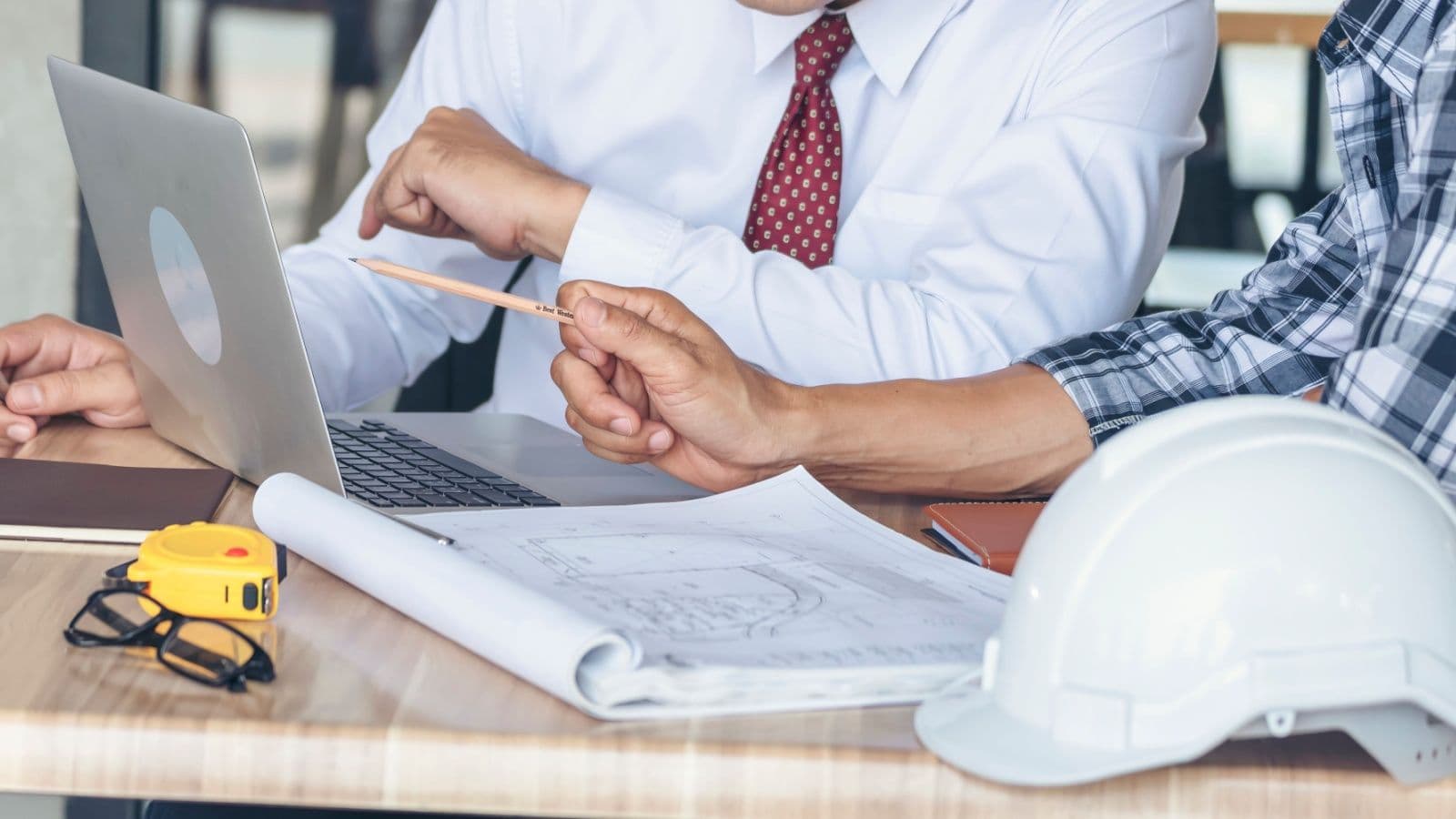 a construction consultant works at a laptop