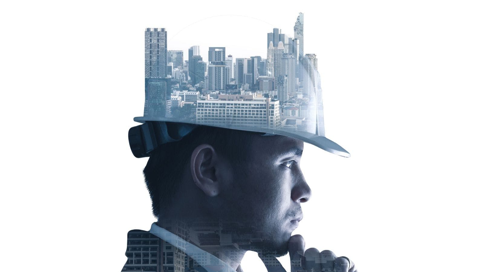 a pensive profile of a man wearing a safety helmet with a city skyline projected on the top