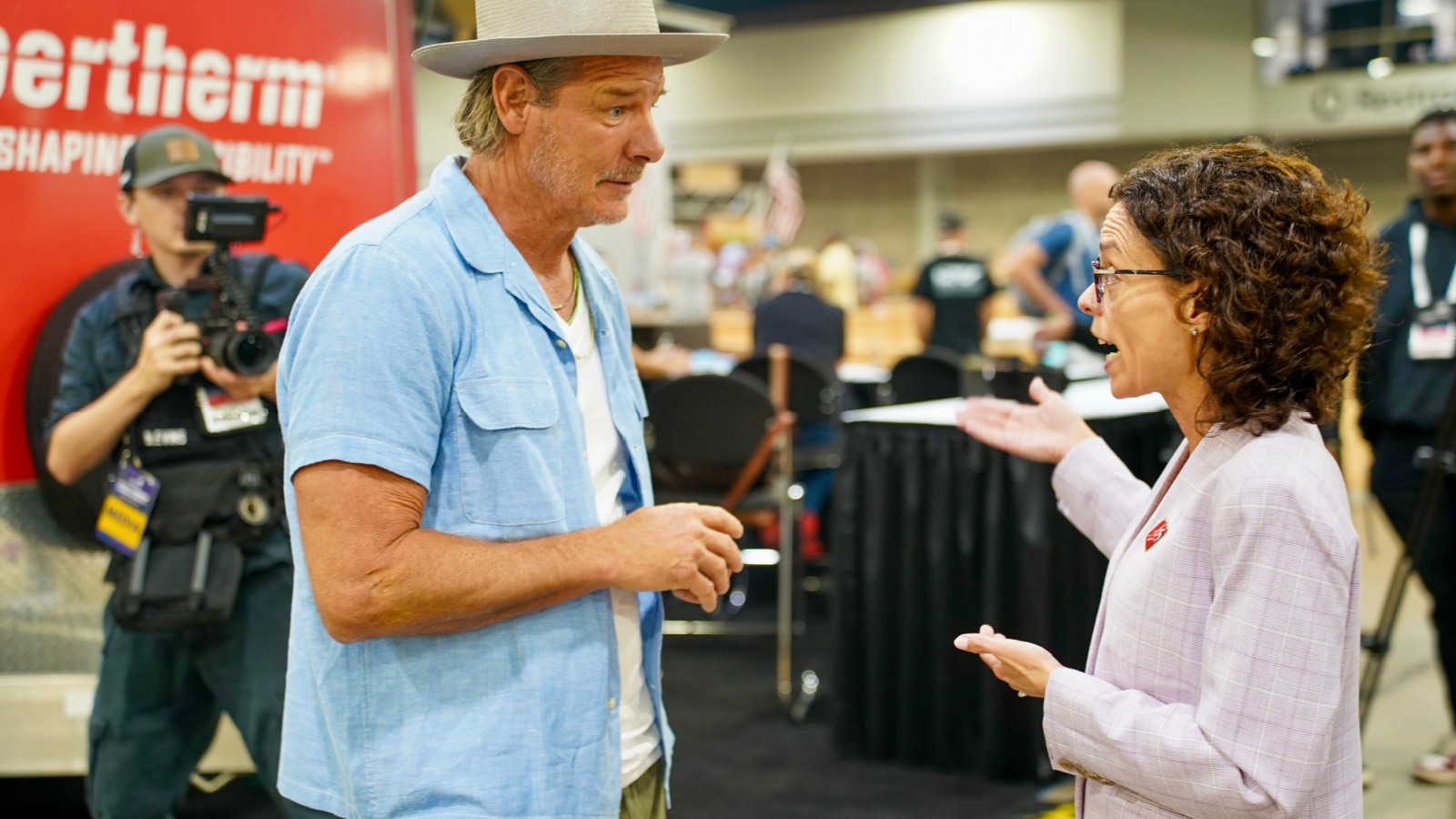 Ty Pennington walks the SkillsUSA floor with Chelle Travis. 