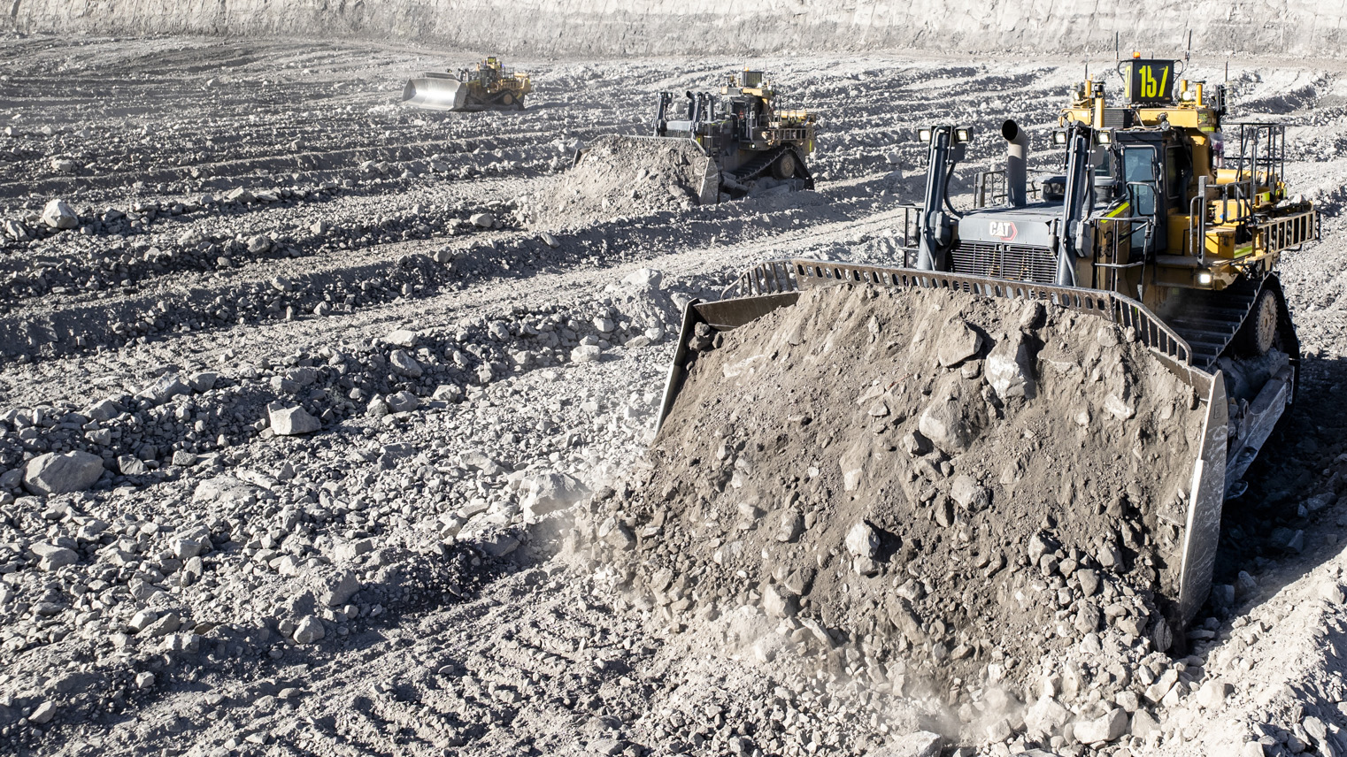 a bulldozer pushing rocks