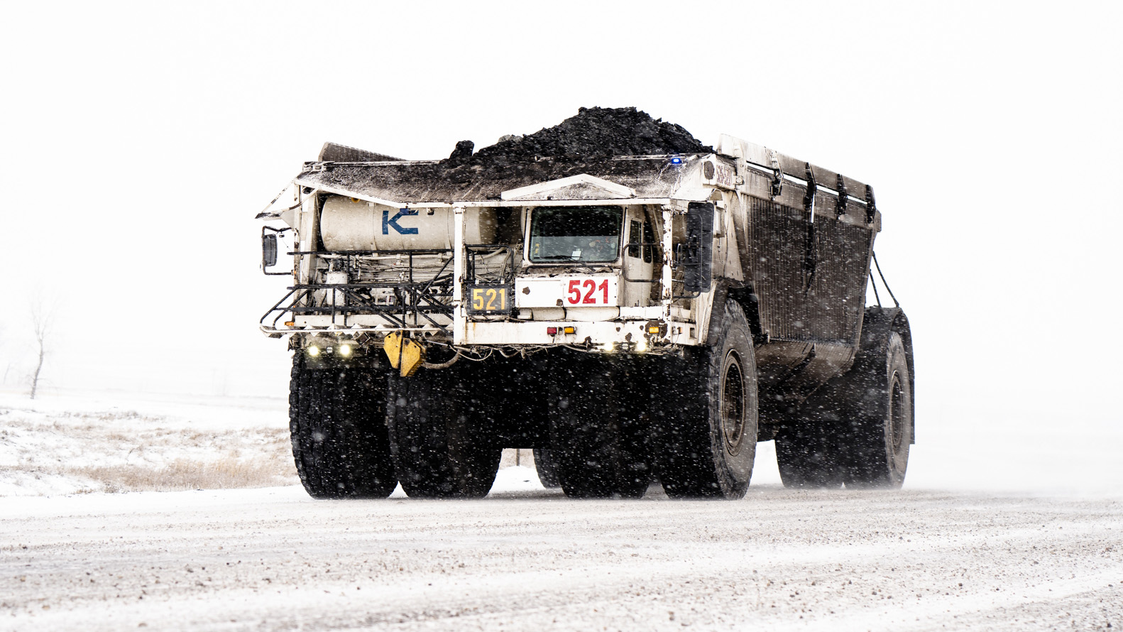 a large dump truck in the snow
