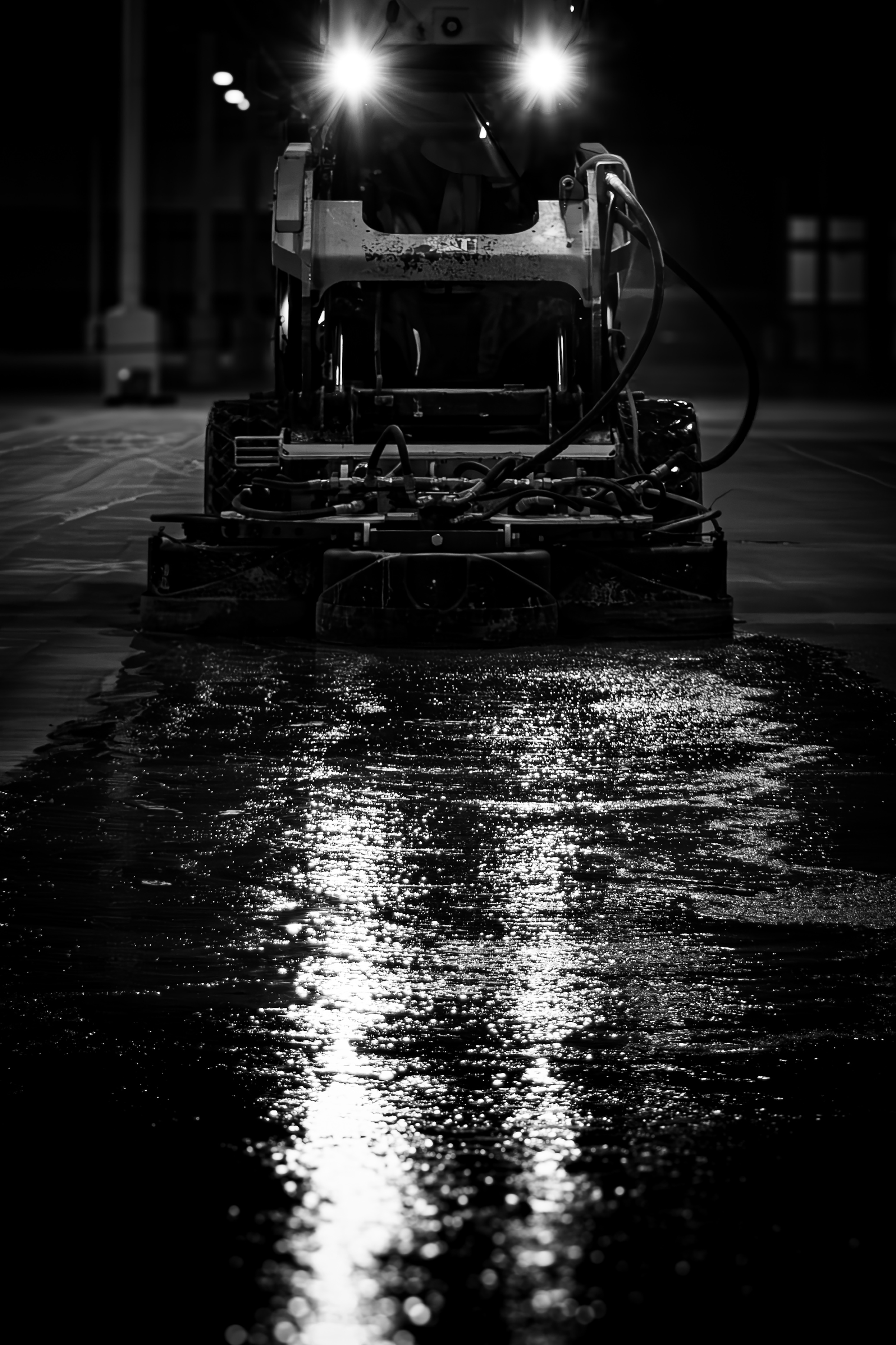 A skidsteer polishing floors 