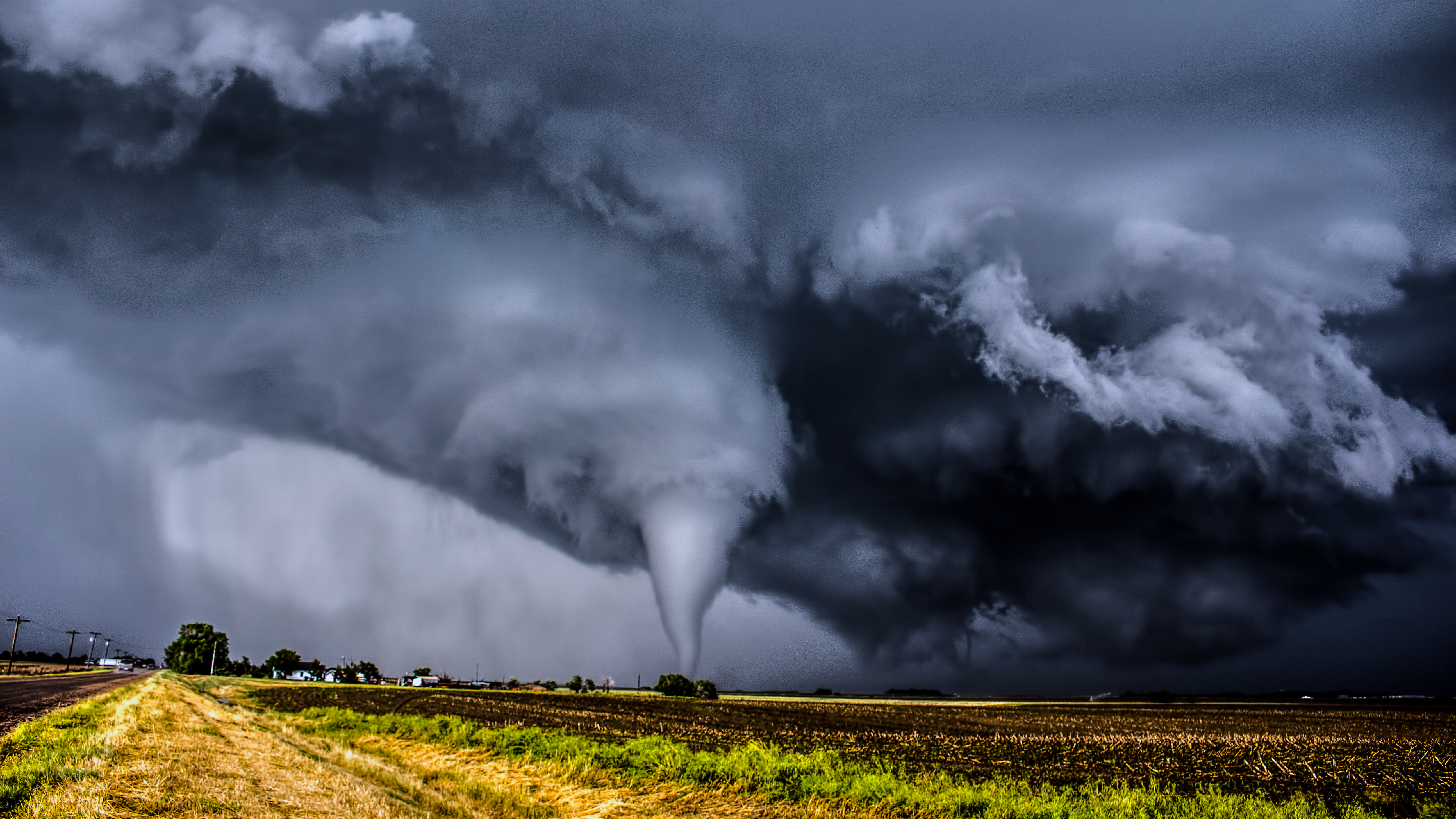 a tornado tearing through a field