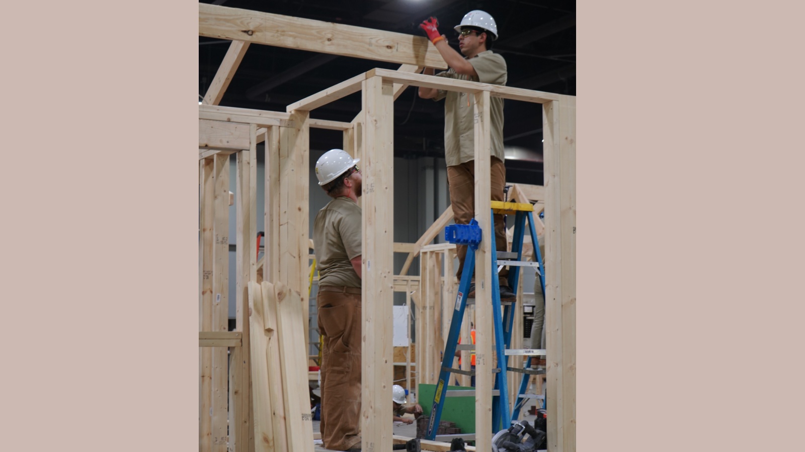 Students crafting with woodwork on the floor of the SkillsUSA National Championship