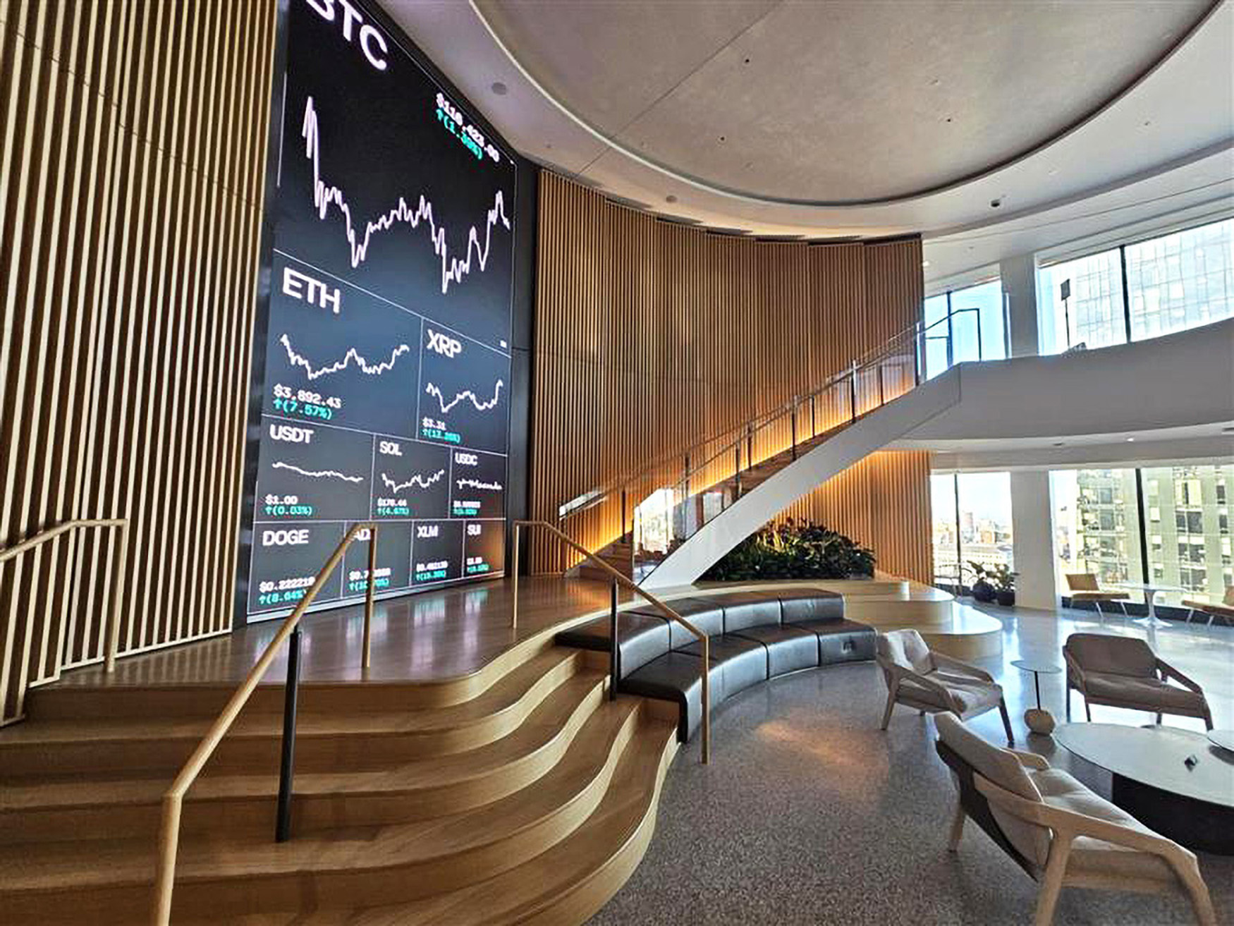 A custom curved staircase in Coinbase's in New York City, NY office.