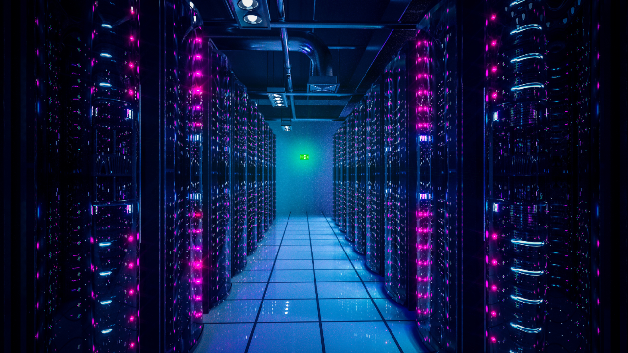 Blue and pink lights illuminating from inside a data center