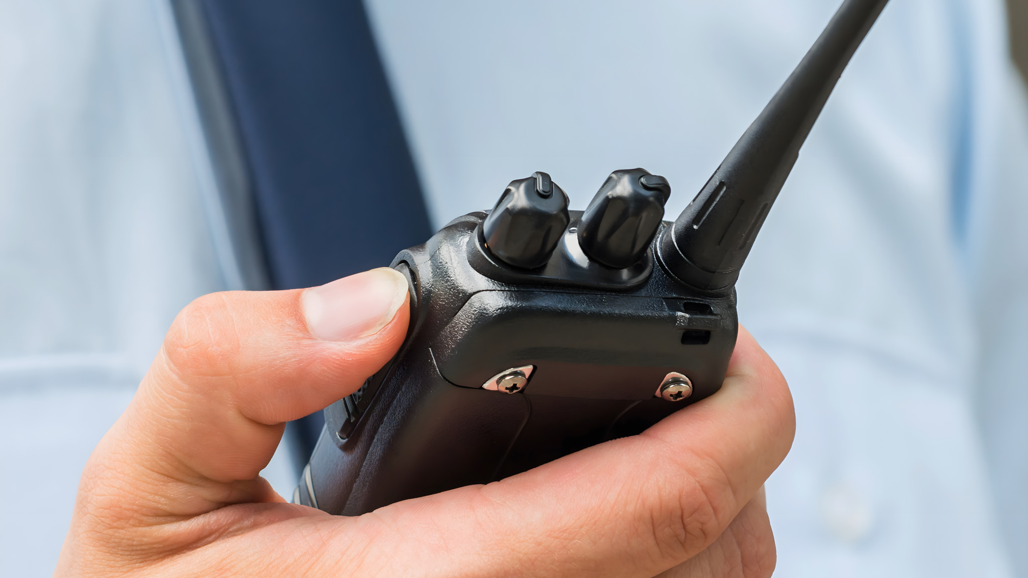 Close-up,Photo,Of,Security,Guard,Holding,Walkie-talkie